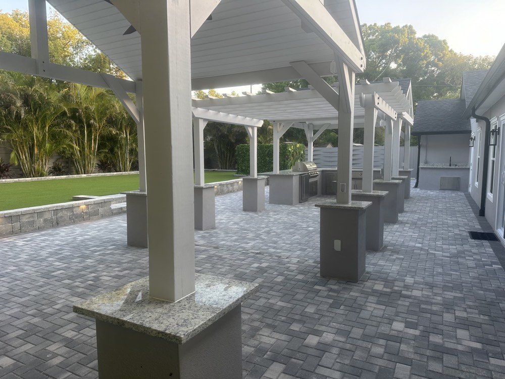 Covered walkway with masonry columns, part-way through construction