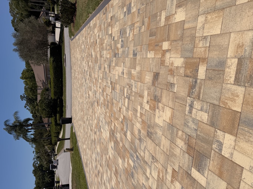 Tumbled paver driveway laid in a running bond pattern